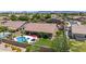 A backyard oasis features a pool and spa, with ample green space and a covered patio for outdoor living and entertaining at 17836 N 52Nd Pl, Scottsdale, AZ 85254