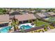 A backyard oasis features a pool and spa, with ample green space and a covered patio for outdoor living and entertaining at 17836 N 52Nd Pl, Scottsdale, AZ 85254