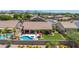A backyard oasis features a pool and spa, with ample green space and a covered patio for outdoor living and entertaining at 17836 N 52Nd Pl, Scottsdale, AZ 85254