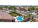 Well-maintained backyard with refreshing freeform pool, covered patio, and ample lounging space with desert landscape at 17836 N 52Nd Pl, Scottsdale, AZ 85254