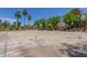 Community basketball court, lined by mature trees and palm trees at 17836 N 52Nd Pl, Scottsdale, AZ 85254