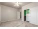 Bedroom featuring carpet, a ceiling fan, and a closet with sliding doors at 17836 N 52Nd Pl, Scottsdale, AZ 85254