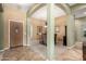 Inviting dining area with tile flooring and an arched entryway at 17836 N 52Nd Pl, Scottsdale, AZ 85254