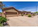 Lovely single-story home with a two-car garage and low-maintenance desert landscaping at 17836 N 52Nd Pl, Scottsdale, AZ 85254