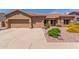 Charming single-story home featuring a two-car garage and beautifully landscaped front yard at 17836 N 52Nd Pl, Scottsdale, AZ 85254