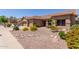 Inviting single-story home with well-manicured desert landscaping and a spacious two-car garage at 17836 N 52Nd Pl, Scottsdale, AZ 85254