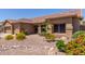 Inviting single-story home with well-manicured desert landscaping and a spacious two-car garage at 17836 N 52Nd Pl, Scottsdale, AZ 85254