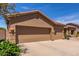 Exterior image of a home showcasing a spacious two-car garage and well-maintained facade at 17836 N 52Nd Pl, Scottsdale, AZ 85254
