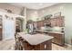 Open kitchen featuring granite countertops, stainless steel appliances, and a large island with bar stool seating at 17836 N 52Nd Pl, Scottsdale, AZ 85254