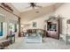 Bright living room featuring vaulted ceilings, a cozy sofa, and a decorative display cabinet, perfect for relaxation at 17836 N 52Nd Pl, Scottsdale, AZ 85254