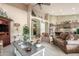 Open-concept living room with vaulted ceilings, neutral decor, and seamless flow to the dining and kitchen areas at 17836 N 52Nd Pl, Scottsdale, AZ 85254