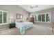 Serene primary bedroom with vaulted ceilings, plantation shutters, and neutral tones, creating a relaxing retreat at 17836 N 52Nd Pl, Scottsdale, AZ 85254