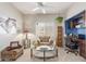 Functional office space featuring a built-in desk, ample storage, and a cozy seating area at 17836 N 52Nd Pl, Scottsdale, AZ 85254
