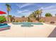 Backyard pool surrounded by vibrant landscaping and a spacious patio area at 17836 N 52Nd Pl, Scottsdale, AZ 85254