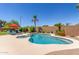 Sparkling pool with a spa, a red umbrella, and desert landscaping in this backyard oasis at 17836 N 52Nd Pl, Scottsdale, AZ 85254