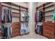 Walk-in closet with built-in organizers featuring shelves, drawers, and rods for ample storage at 17836 N 52Nd Pl, Scottsdale, AZ 85254