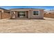 The backyard features a partially covered patio area, dirt landscaping, and a block fence at 18210 W Hess St, Goodyear, AZ 85338