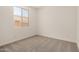 Bedroom with carpet and a window that allows for natural lighting at 18210 W Hess St, Goodyear, AZ 85338