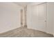 Carpeted bedroom with neutral walls and closet space for efficient storage at 18210 W Hess St, Goodyear, AZ 85338