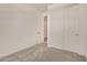 Bedroom with carpet, access to closet, and ensuite bathroom at 18210 W Hess St, Goodyear, AZ 85338