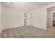 Neutral carpeted bedroom with modern doors and trims offers calm and comfort at 18210 W Hess St, Goodyear, AZ 85338