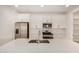 Modern kitchen featuring stainless steel appliances, white cabinetry and an island with a sink at 18210 W Hess St, Goodyear, AZ 85338