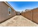 Long side yard featuring a block fence and dirt landscaping at 18210 W Hess St, Goodyear, AZ 85338