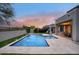 Backyard swimming pool with patio and lush landscaping at 18515 N 97Th Way, Scottsdale, AZ 85255