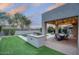 The backyard boasts a patio, outdoor grill, swimming pool, and lush landscaping at 18515 N 97Th Way, Scottsdale, AZ 85255