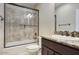 Bathroom featuring a granite sink, bathtub, and bronze fixtures at 18515 N 97Th Way, Scottsdale, AZ 85255