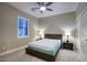Bright bedroom features plantation shutters, overhead fan and neutral colored walls at 18515 N 97Th Way, Scottsdale, AZ 85255