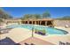 Spacious community pool and cabanas with outdoor seating, an ideal space to relax at 18515 N 97Th Way, Scottsdale, AZ 85255