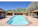 Upscale community pool and cabanas with outdoor seating, creating a relaxing vacation atmosphere at 18515 N 97Th Way, Scottsdale, AZ 85255