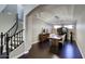Dining room and staircase featuring dark wood floors and a modern chandelier at 18515 N 97Th Way, Scottsdale, AZ 85255