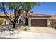 Charming home with a tile roof, manicured front yard, and a spacious three-car garage, offering curb appeal at 18515 N 97Th Way, Scottsdale, AZ 85255