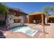 Cozy outdoor hot tub and fireplace, perfect for year-round relaxation at 18515 N 97Th Way, Scottsdale, AZ 85255