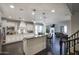 Elegant kitchen features white cabinetry, granite countertops, stainless steel appliances, and a large island with bar seating at 18515 N 97Th Way, Scottsdale, AZ 85255