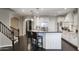 Spacious kitchen with sleek stainless steel appliances, granite countertops, island seating and stairway access at 18515 N 97Th Way, Scottsdale, AZ 85255