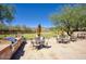 Outdoor kitchen and seating area with stainless grill and views of the mountains at 18515 N 97Th Way, Scottsdale, AZ 85255