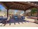 Outdoor kitchen with BBQ grills, countertops, and seating, an entertainer's dream at 18515 N 97Th Way, Scottsdale, AZ 85255