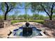 Community park with a water fountain and mature trees providing shade at 18515 N 97Th Way, Scottsdale, AZ 85255