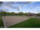 Community playground featuring swing sets, climbing structures, and sandy play areas surrounded by well-maintained landscaping at 18515 N 97Th Way, Scottsdale, AZ 85255