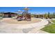 Community playground featuring a slide, climbing wall, and shaded seating areas at 18515 N 97Th Way, Scottsdale, AZ 85255