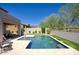 Backyard view of the pool with water features and lounge area at 18515 N 97Th Way, Scottsdale, AZ 85255