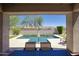 Backyard view of a private pool and patio area with desert landscaping at 18515 N 97Th Way, Scottsdale, AZ 85255