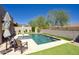 View of the rectangular pool with fountain features and lush landscaping at 18515 N 97Th Way, Scottsdale, AZ 85255