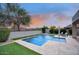 Backyard swimming pool with water fountains, a patio and lush landscaping at 18515 N 97Th Way, Scottsdale, AZ 85255