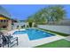 An inviting backyard featuring a pool with water fountains, and lush landscaping at 18515 N 97Th Way, Scottsdale, AZ 85255
