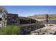 Community sign for Windgate Ranch with stone accents and desert scenery at 18515 N 97Th Way, Scottsdale, AZ 85255