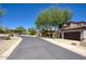 Street view of neighborhood with mature landscaping and well-maintained homes at 18515 N 97Th Way, Scottsdale, AZ 85255